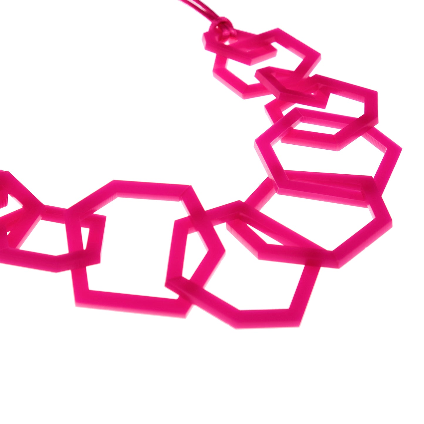 Fuchsia Pink geometric necklace on a white background