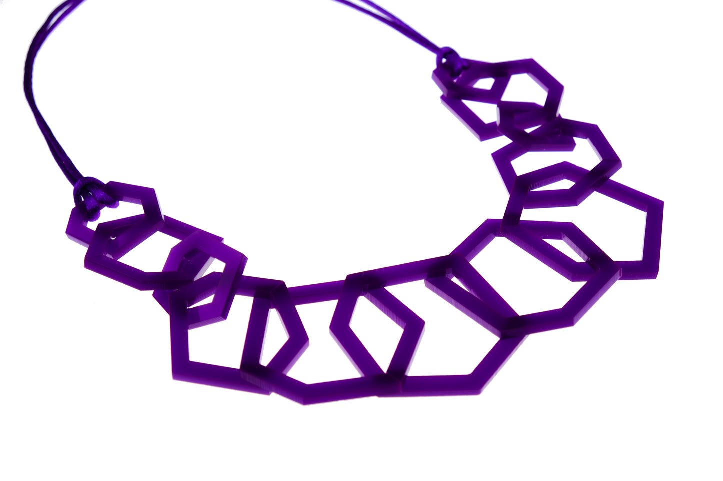 Purple geometric necklace on a white background