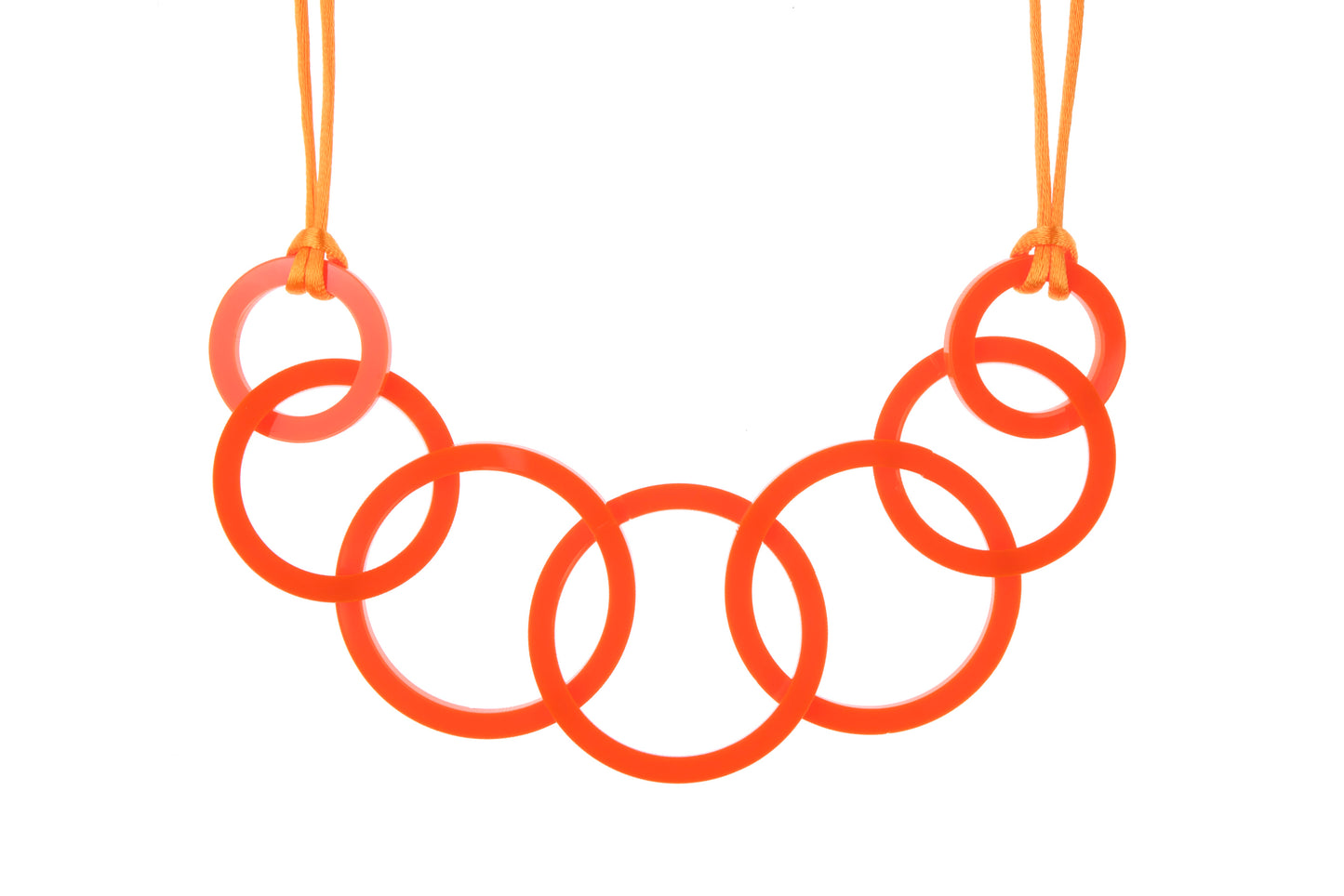 Necklace with orange interlocking rings on a white background