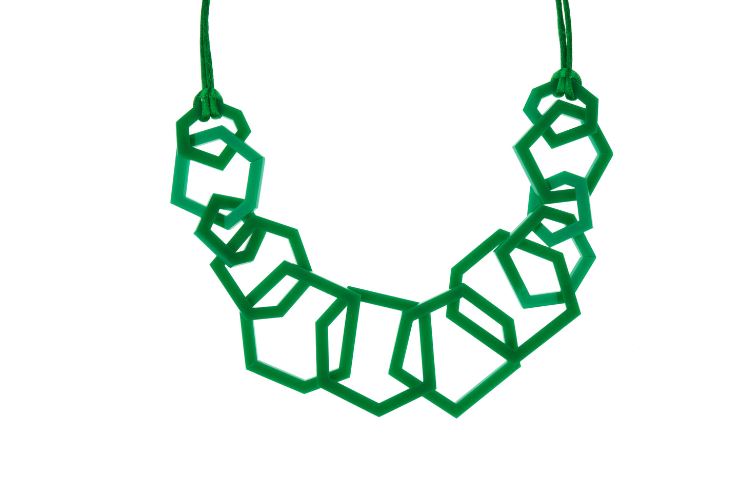 Green geometric necklace on a white background
