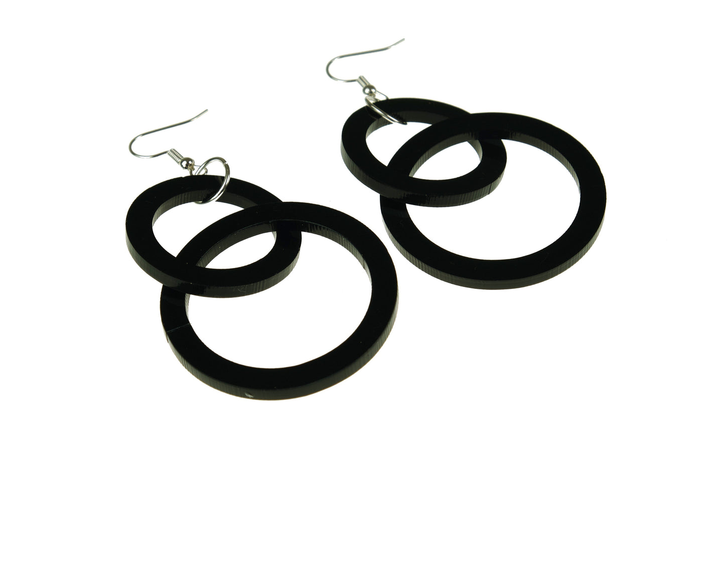 Black hoop earrings on a white background