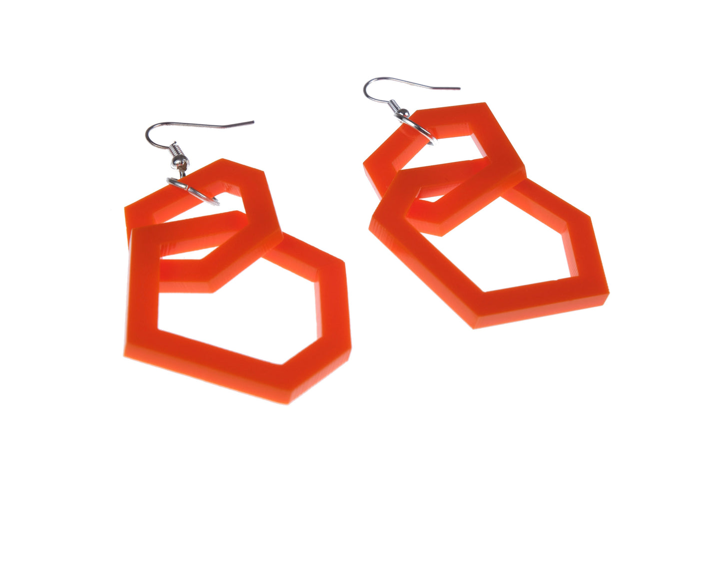 orange geometric earrings on a white background