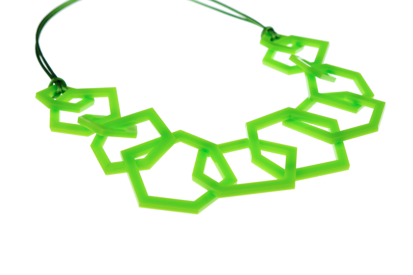 Lime green geometric necklace on a white background