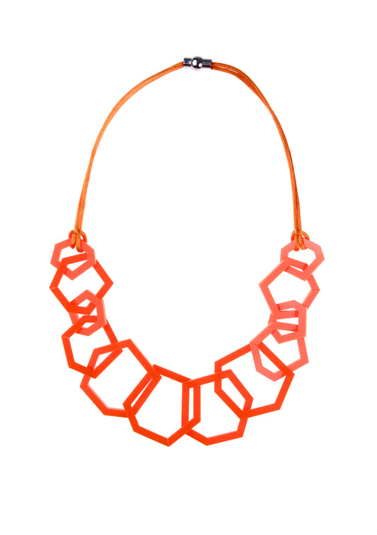 Orange geometric necklace on a white background