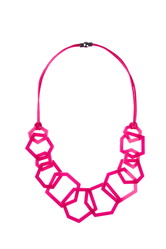 Fuchsia Pink geometric necklace on a white background