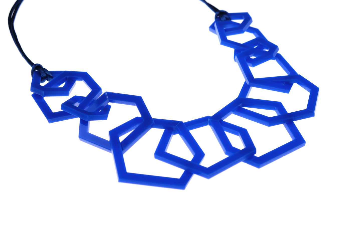 Royal Blue geometric necklace on a white background