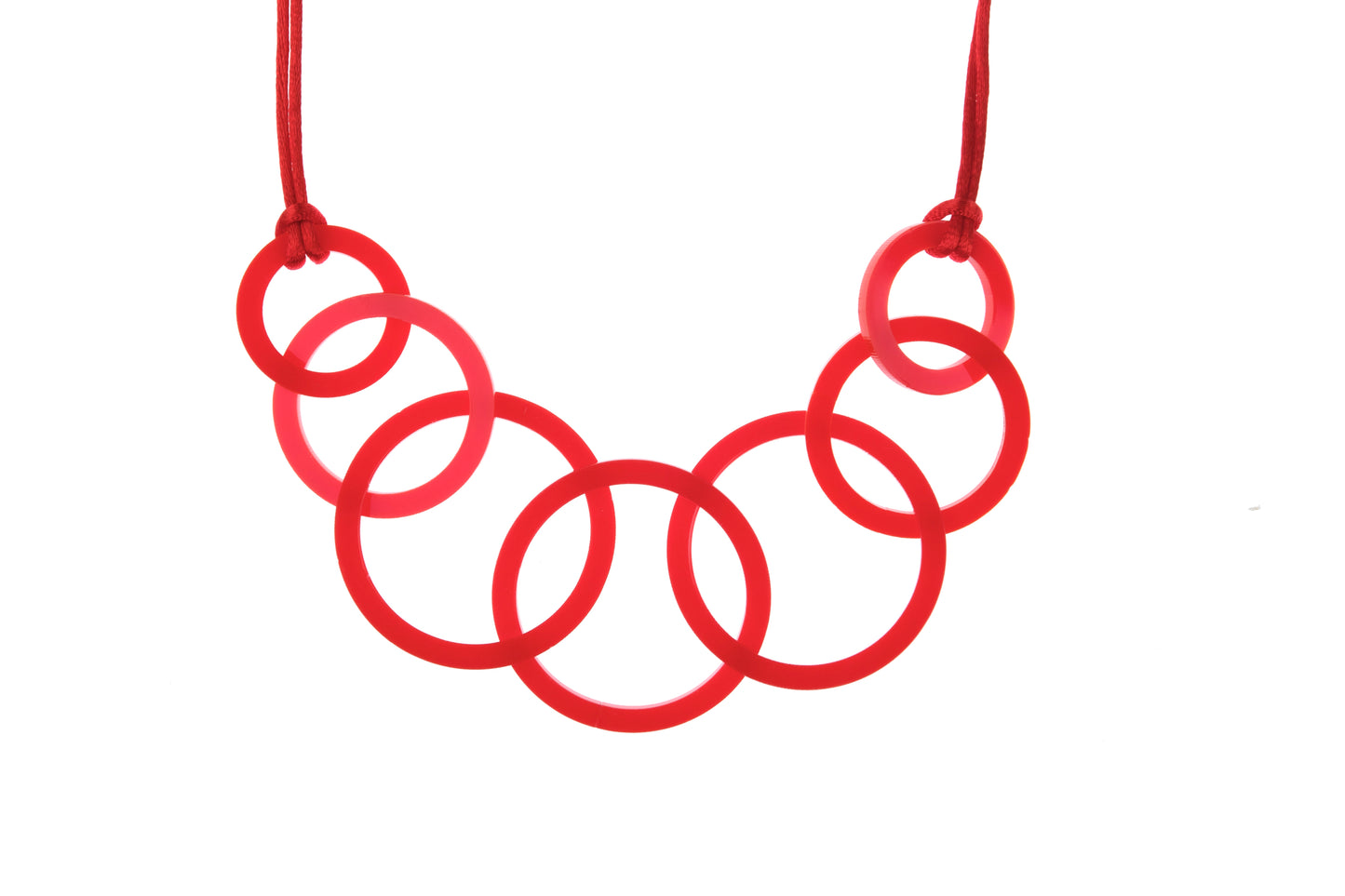 Red circular necklace on a white background
