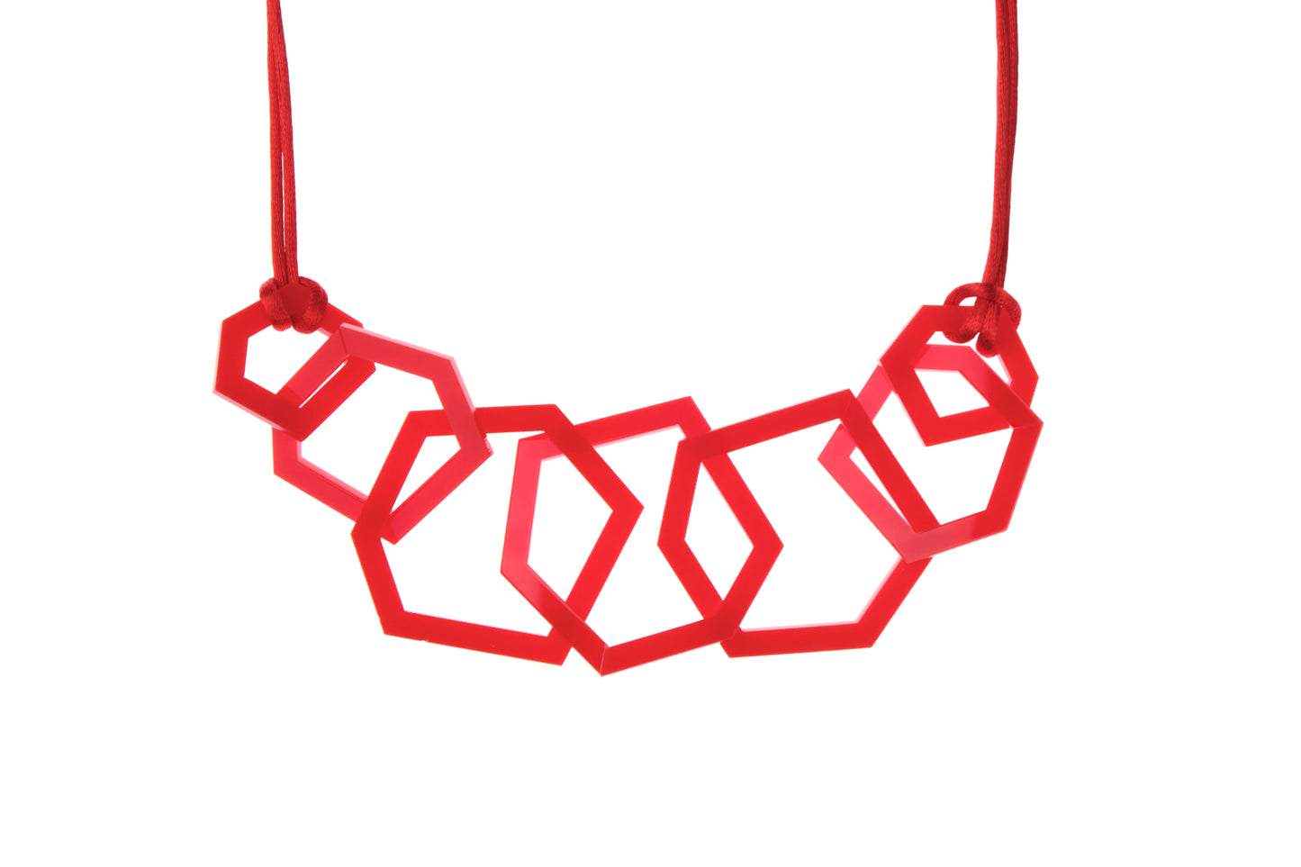 Red geometric necklace on a white background
