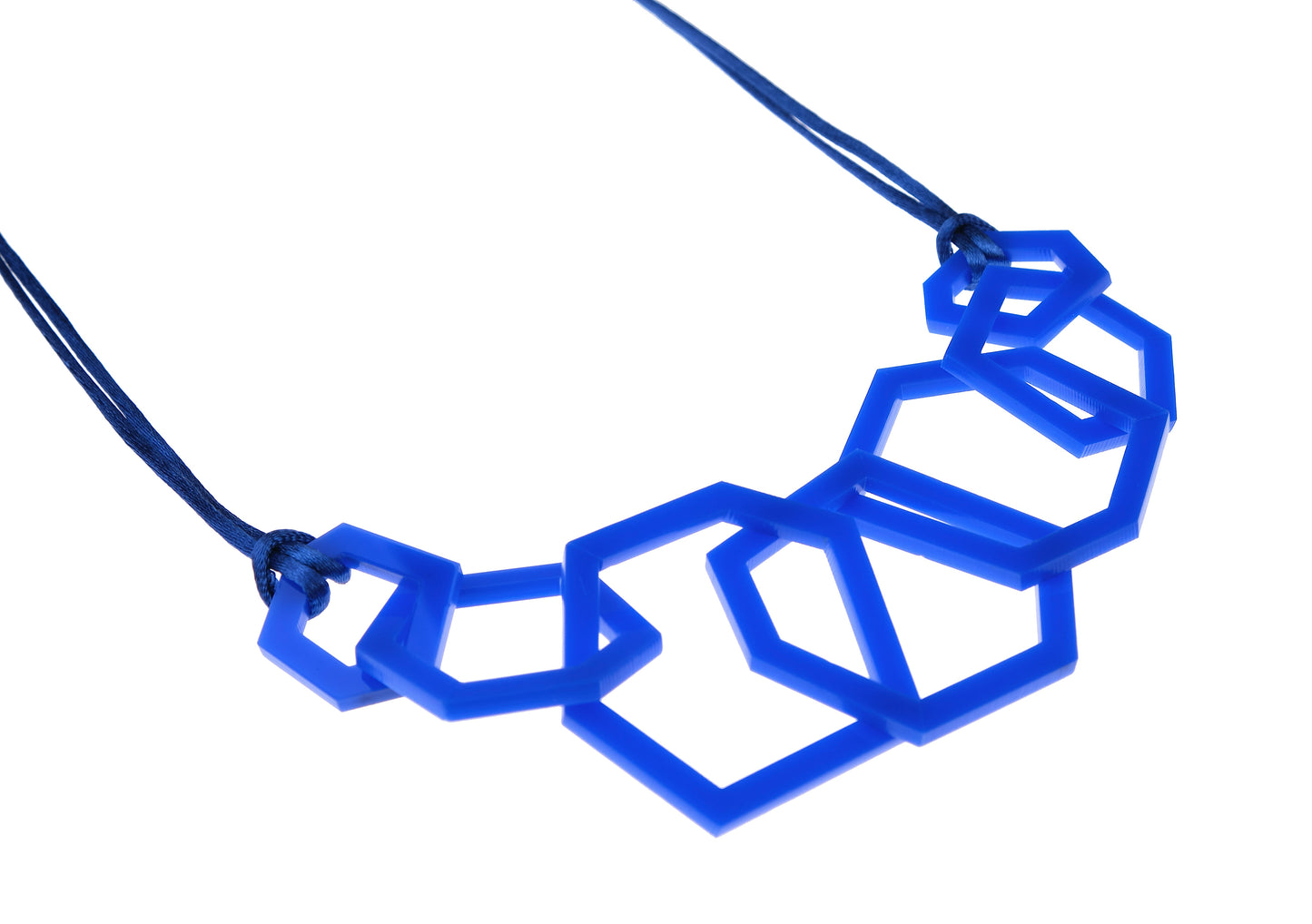 Blue geometric necklace on a white background