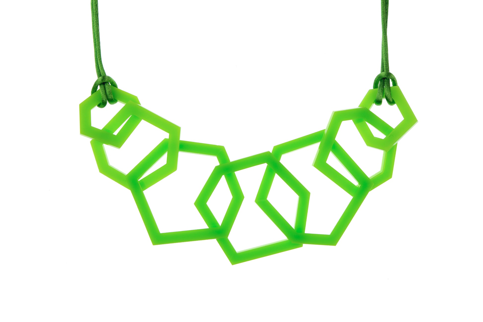 Detail of Lime Green geometric acrylic necklace on a white background