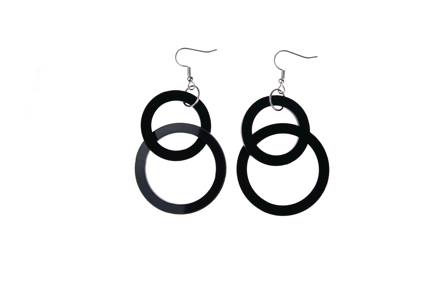 Black circular earrings on a white background