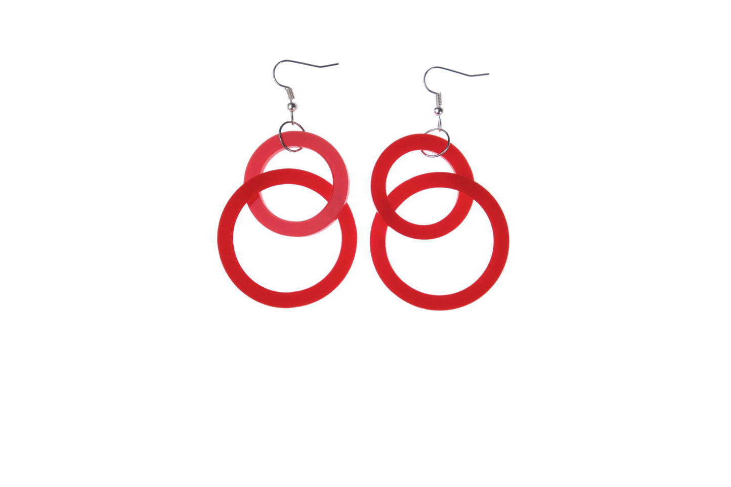 Red circular earrings on a white background