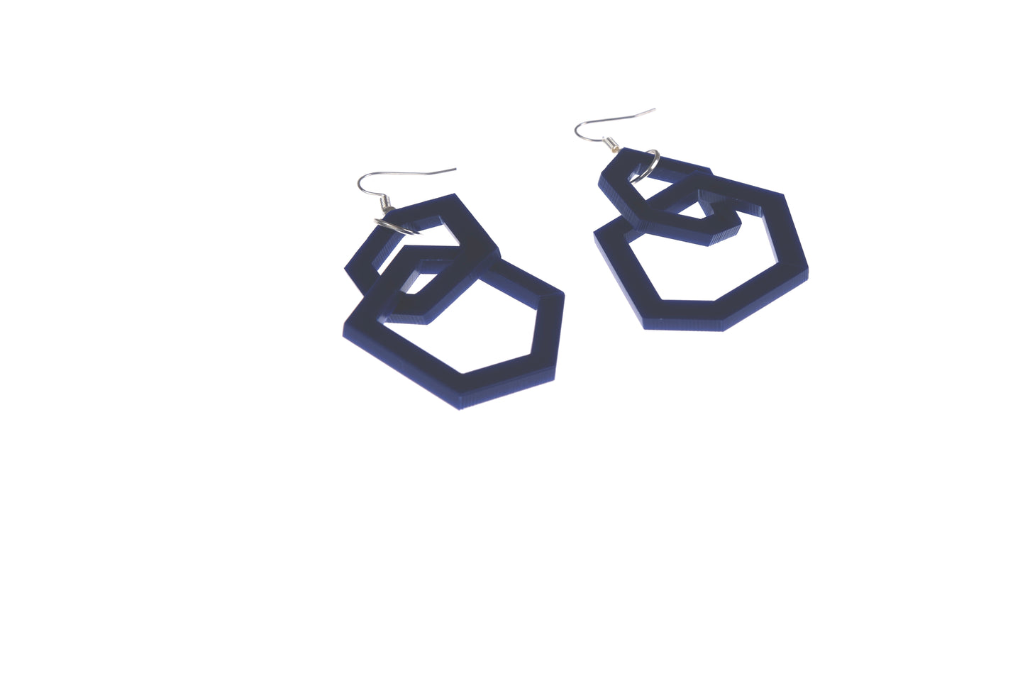 Navy blue geometric hoop earrings on a white background