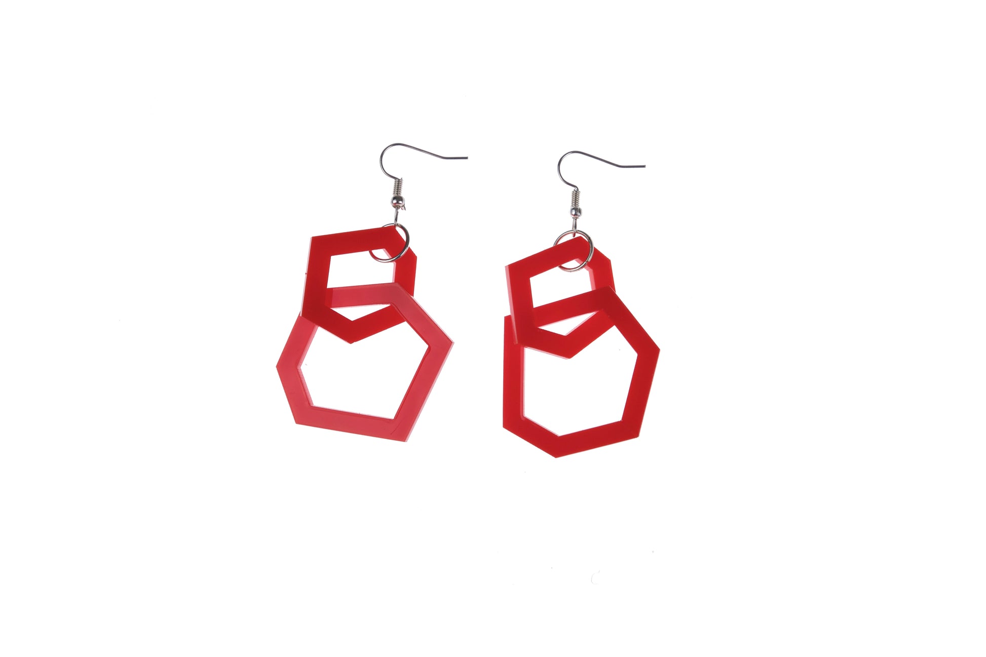 Red geometric earrings on a white background