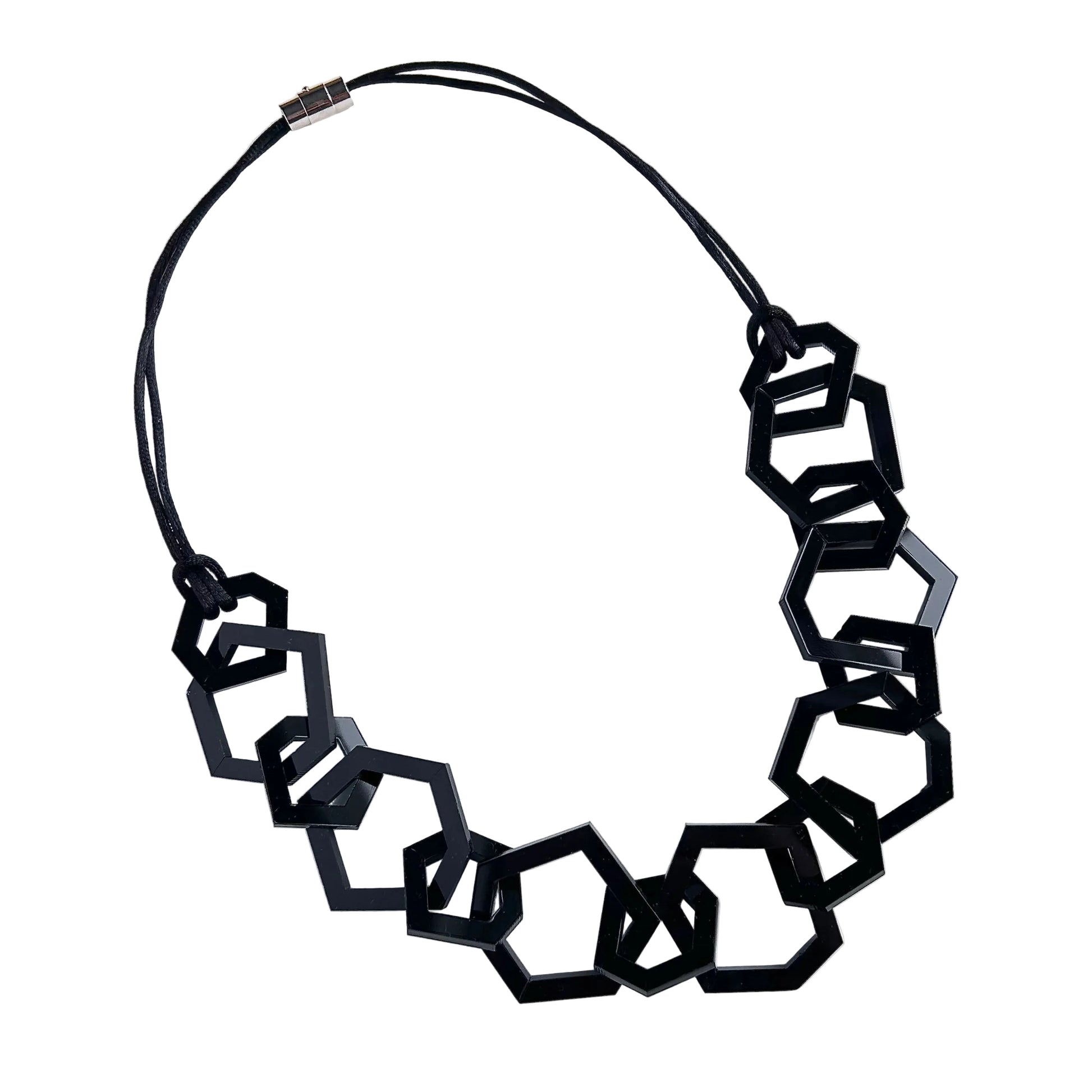 Black geometric necklace on a white background