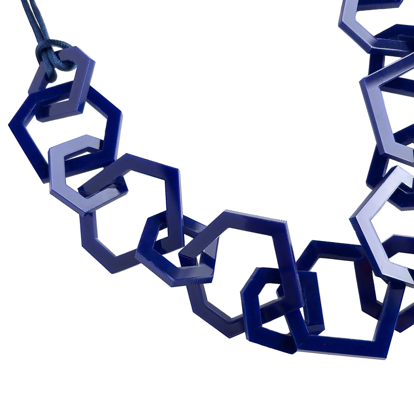 Blue geometric necklace on a white background