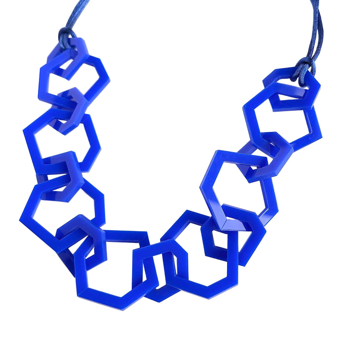 Blue geometric necklace on a white background