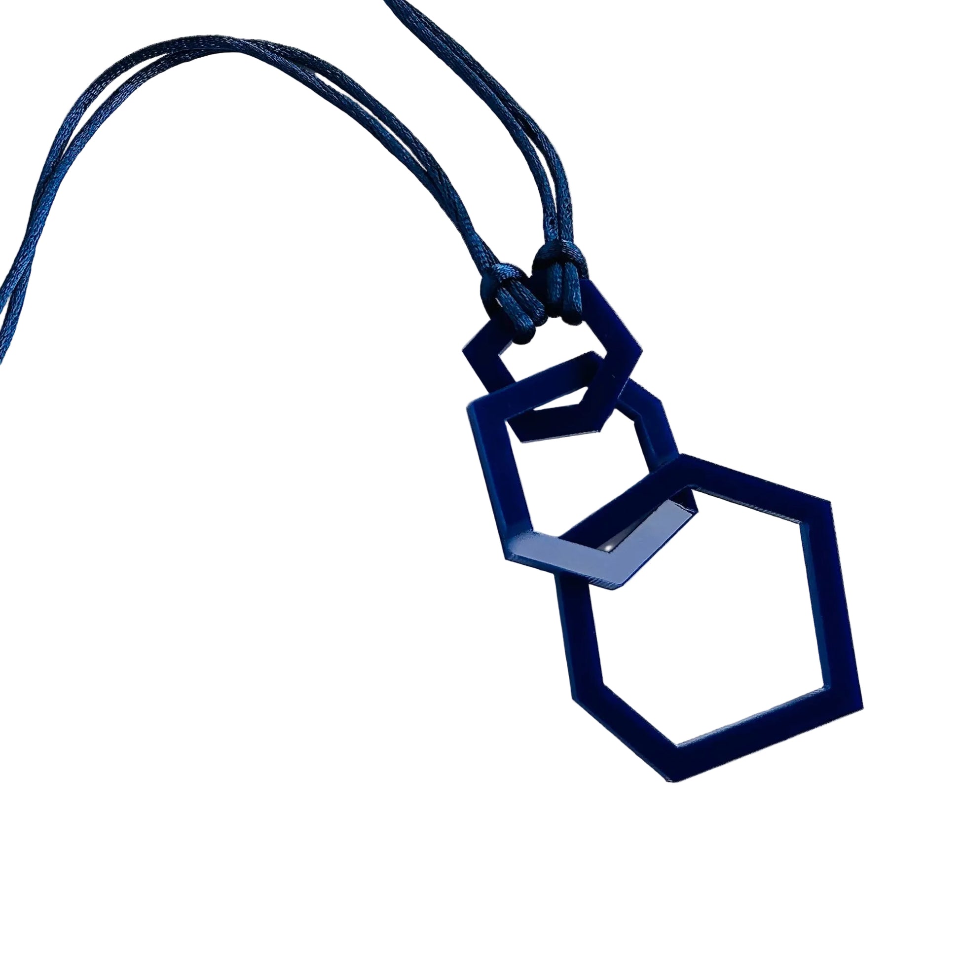 Navy blue geometric pendant necklace on a white background