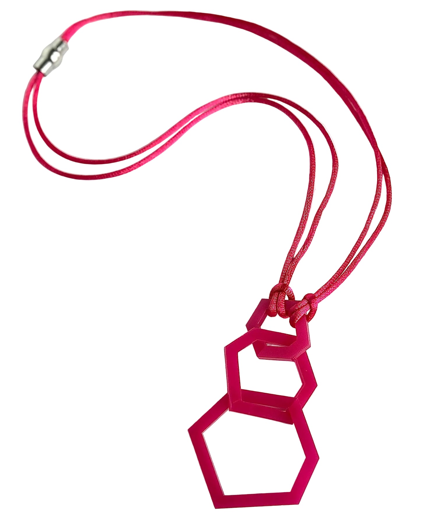 Pink geometric pendant on a red cord against a white background