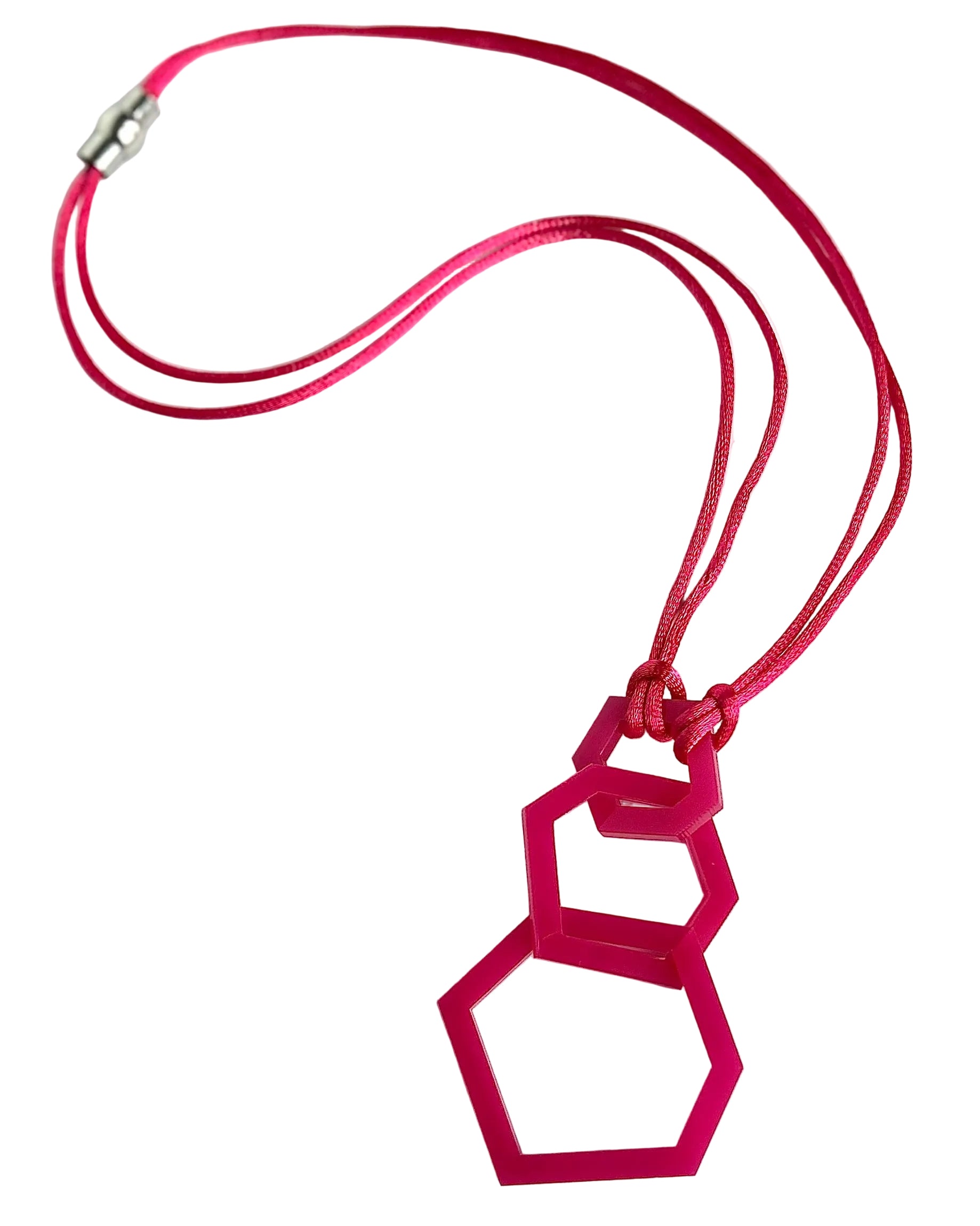 Pink geometric pendant on a red cord against a white background