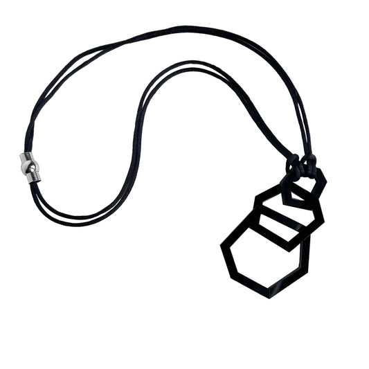 Black geometric necklace on a white background