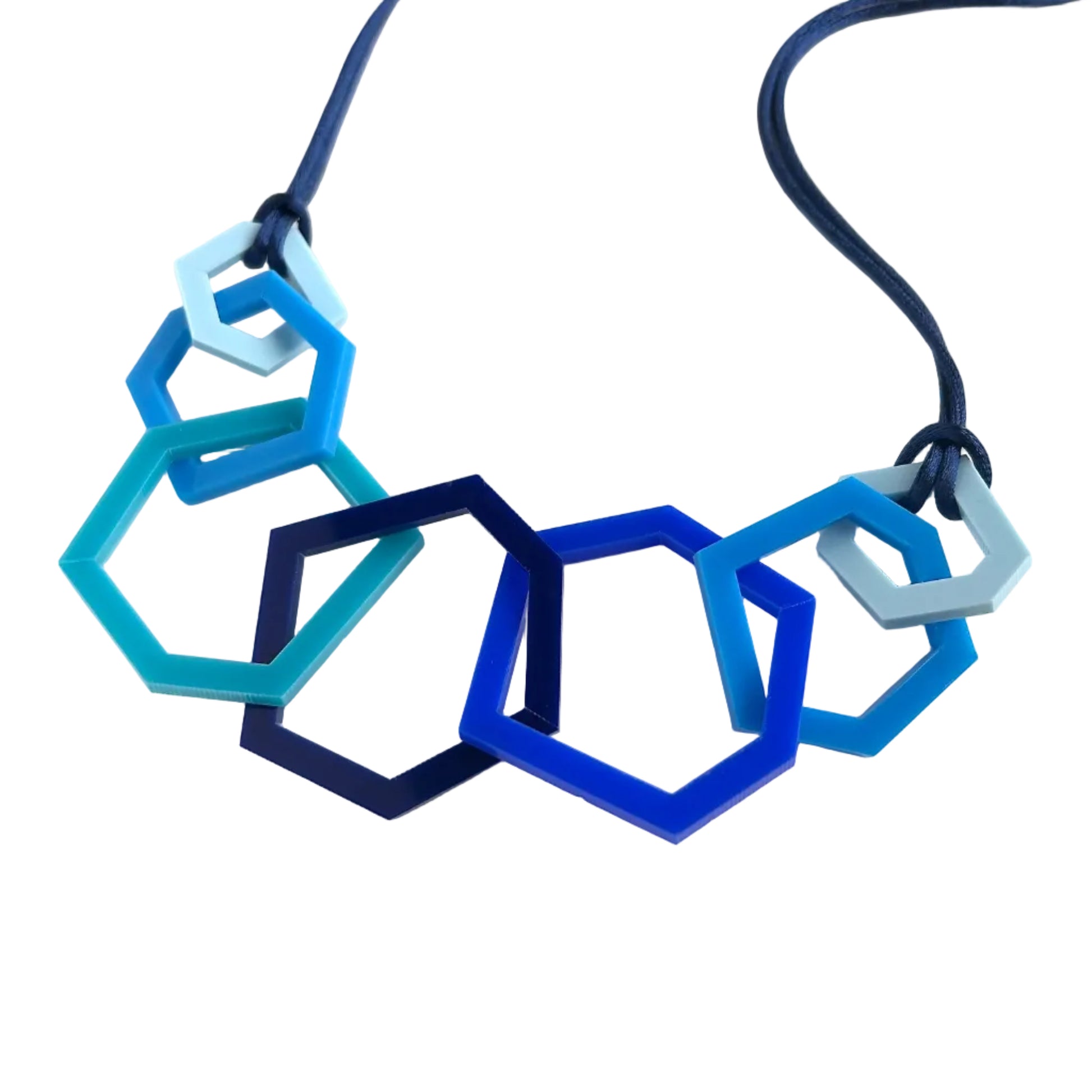 Navy, royal and turquoise blue necklace on white background