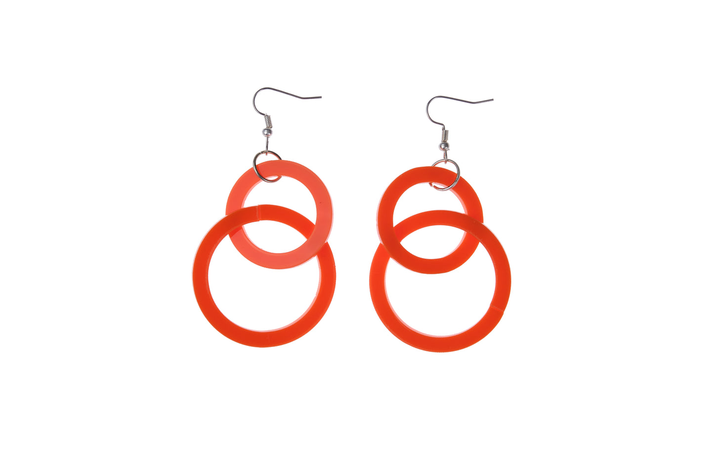 orange circular earrings on a white background