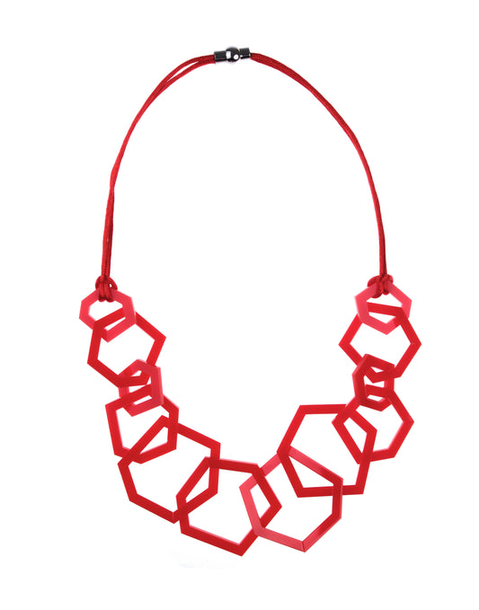 Red geometric necklace on a white background
