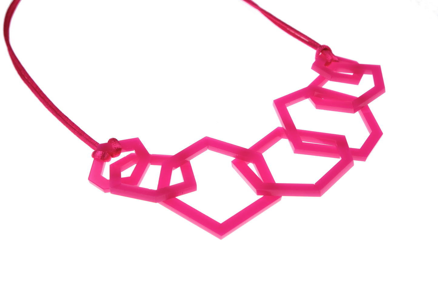 Fuchsia Pink geometric necklace on a white background