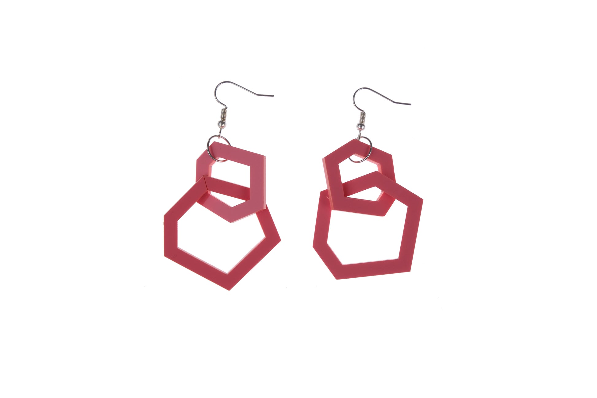 coral pink geometric earrings on a white background