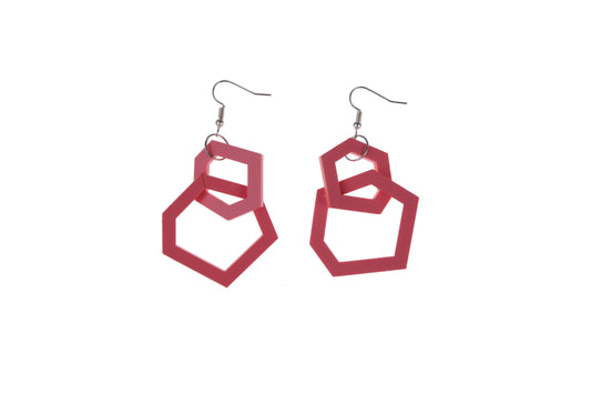 coral pink geometric earrings on a white background