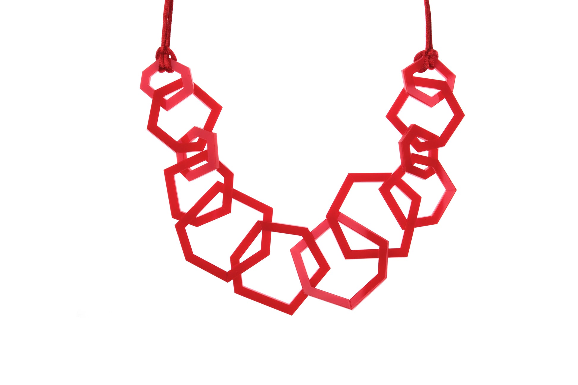 Red geometric necklace on a white background