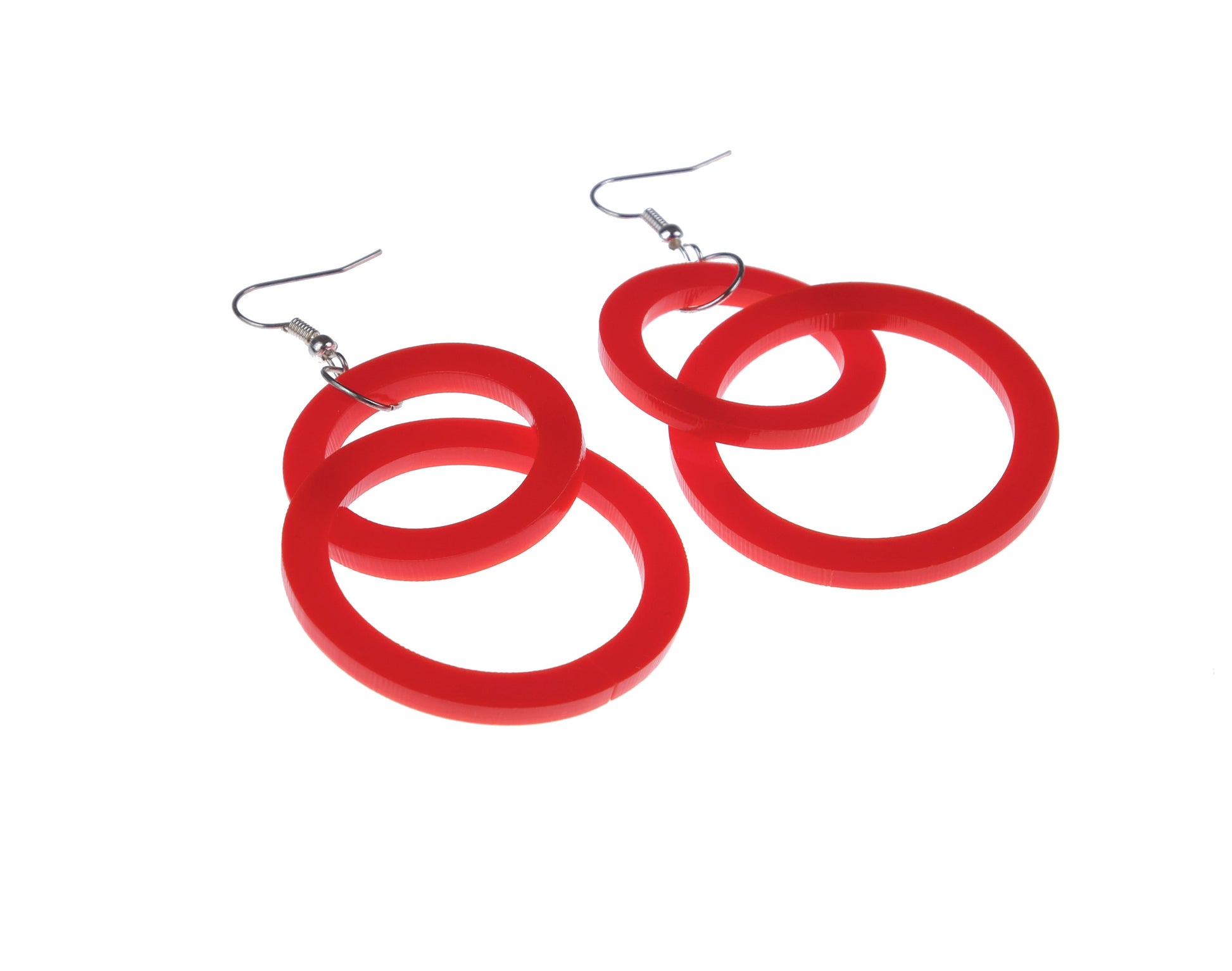 Red hoop earrings on a white background