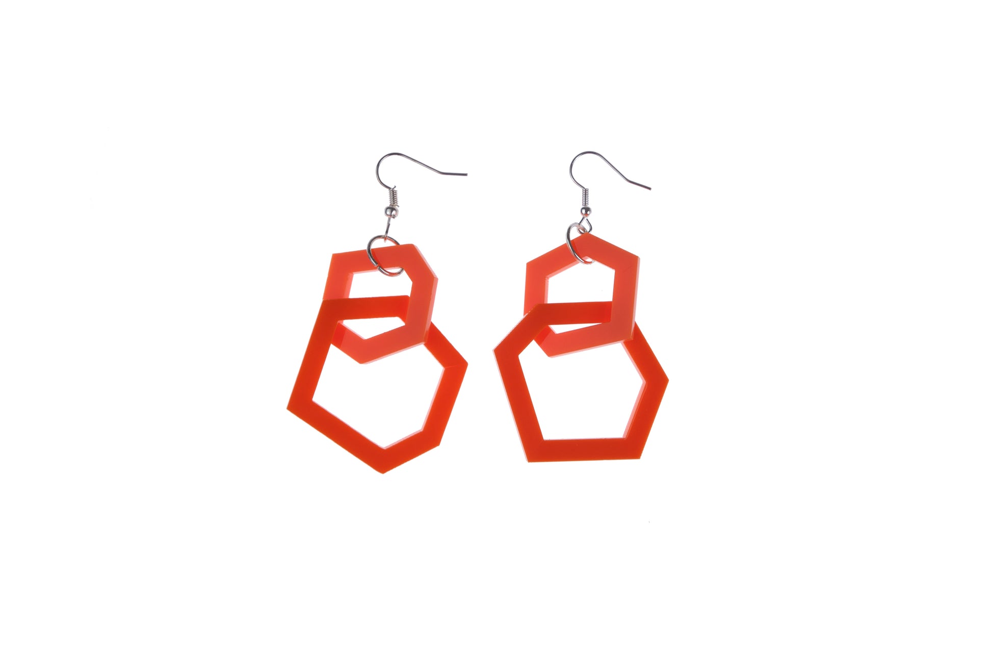 orange geometric earrings on a white background