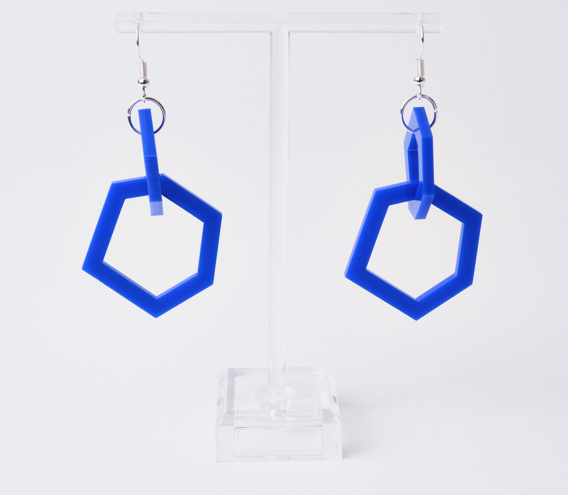 Royal Blue geometric earrings on a white background